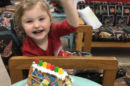 Child with gingerbread house