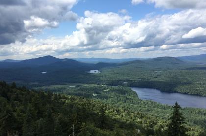 The view of mountains and a large lake from above