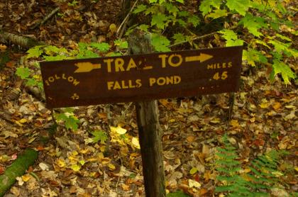 A sign pointing to Falls Pond