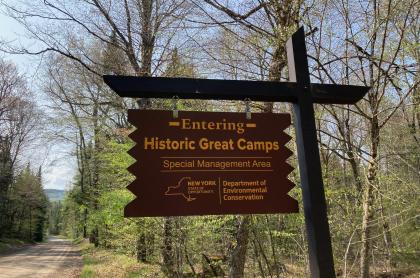 A road sign for "Historic Great Camps" 