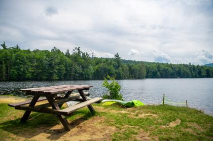 A picnic table by the water