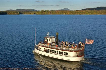 WW Durant Boat on the lake with mountains in background