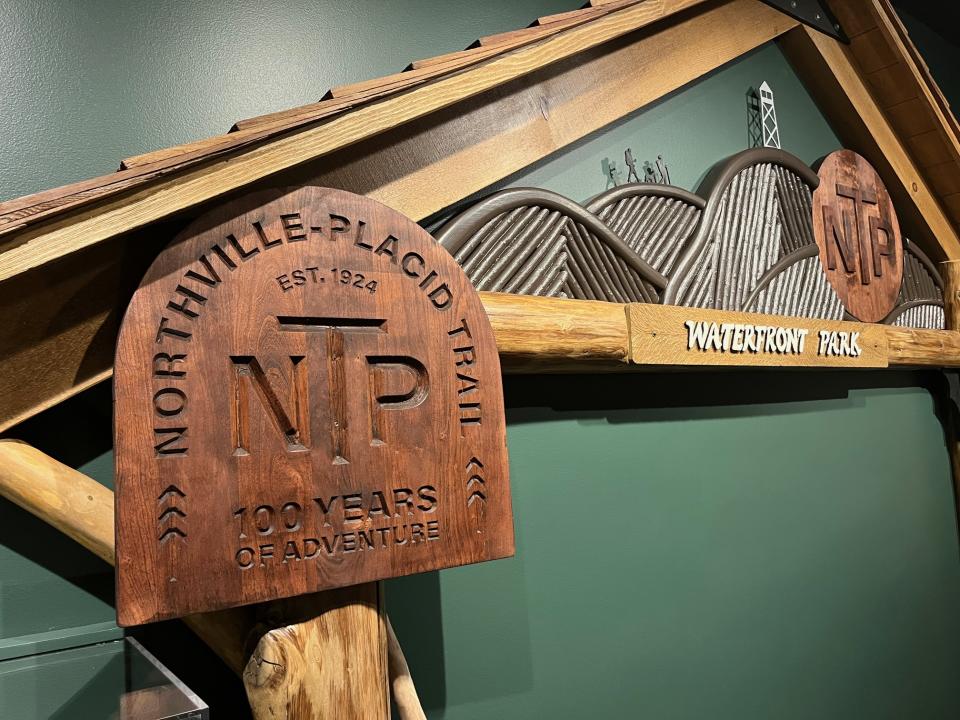 A wooden sign for the NPT at an exhibit