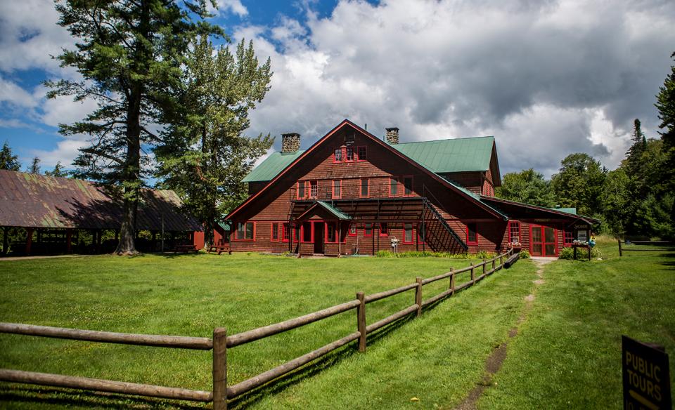 A red barn on a historic great camp site.