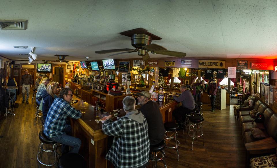 People sitting at the bar in the Oxbow