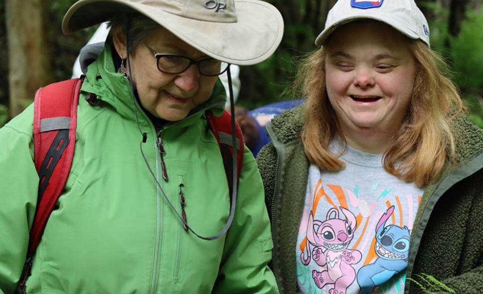 A woman and a girl with down syndrome enjoying the outdoors