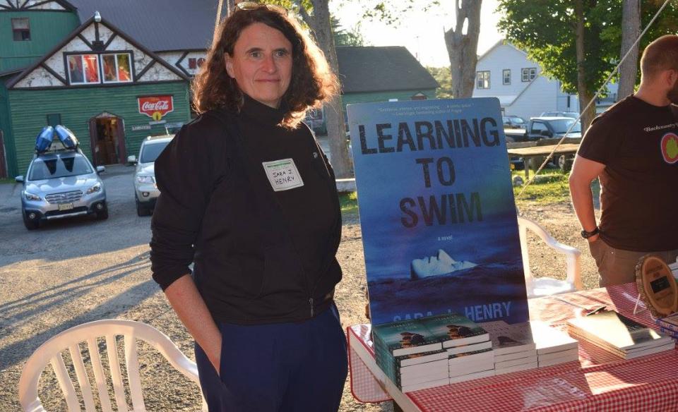 An author poses for a photograph at the Adirondack Authors Night