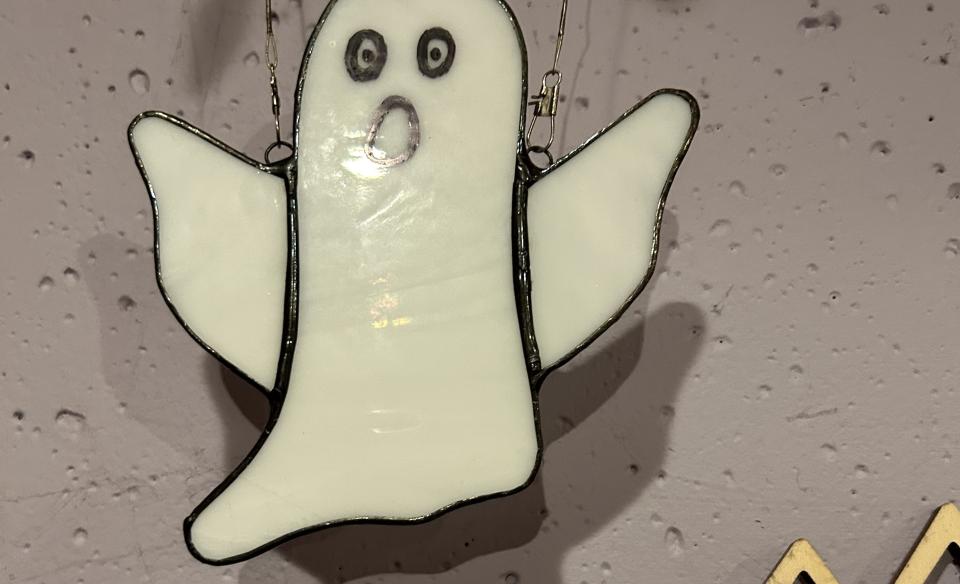 A stained glass ghost ornament