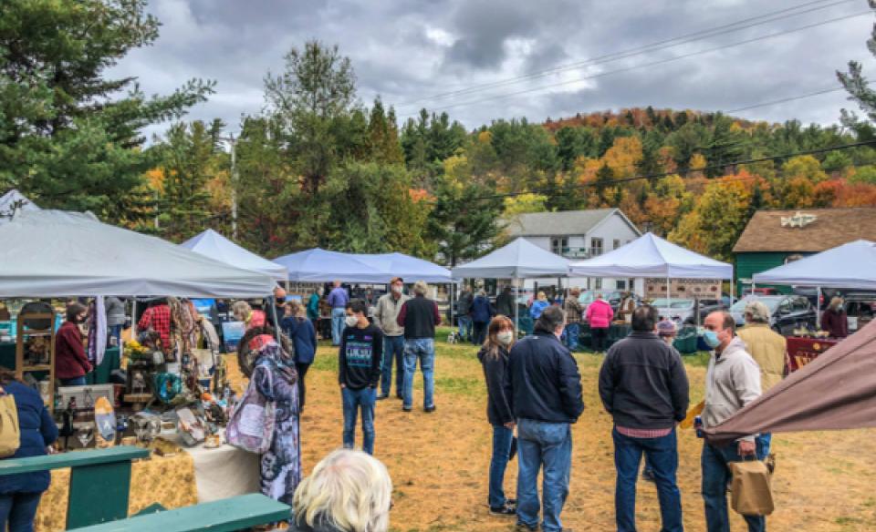 Many people and vendor pop ups at Hoss's Campground for the Octo-Bear-Fest